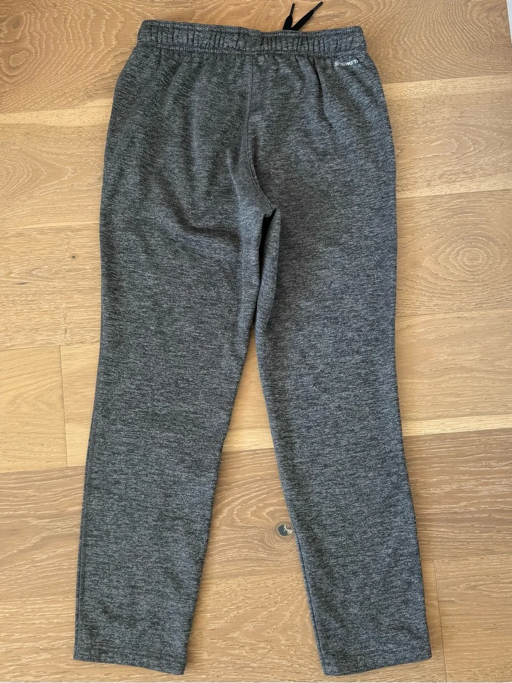 adidas Grey Climawarm Joggers With Fleece Lining And Pockets.